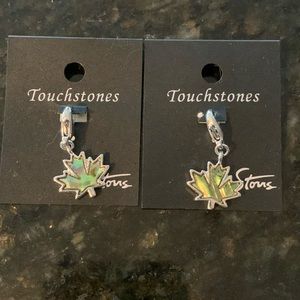 Two abalone maple leaf charms